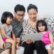 Happy Asian Chinese Family Playing with Digital Tablet Together